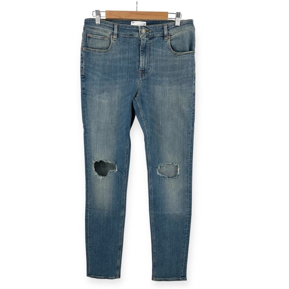 ASOS DESIGN skinny jeans in tinted mid wash with knee rips Size 32x34